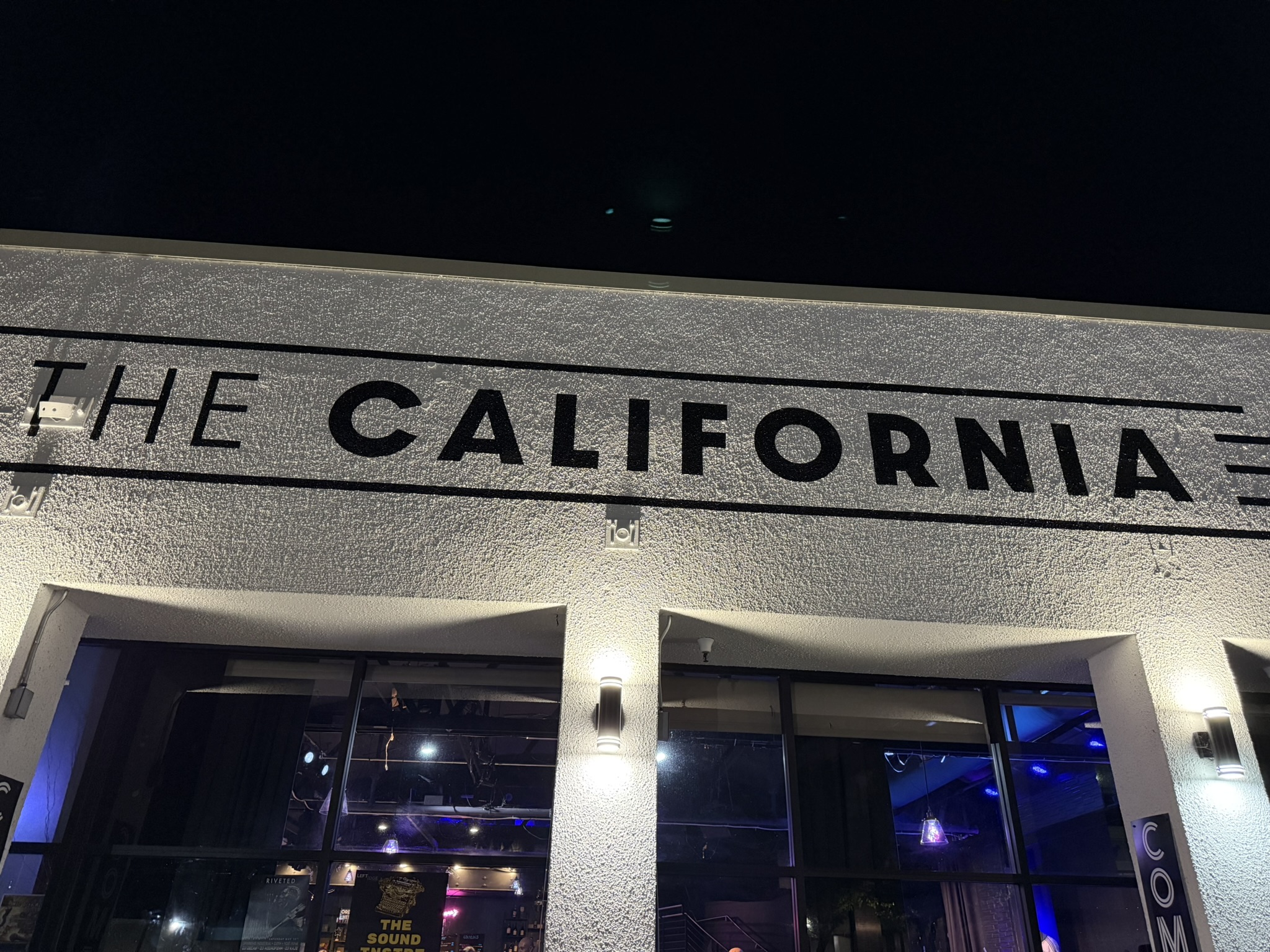 The California Theatre sign lit at night in downtown Santa Rosa